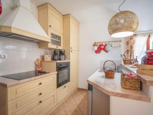 a kitchen with a sink and a stove top oven at Holiday Home Villa KIM by Interhome in Brest