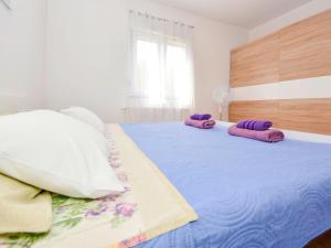 Postel nebo postele na pokoji v ubytování Holiday Home Stipe by Interhome