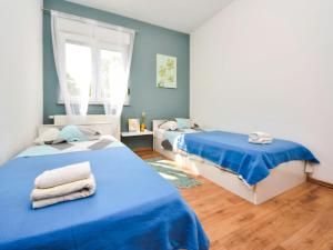 Postel nebo postele na pokoji v ubytování Holiday Home Stipe by Interhome