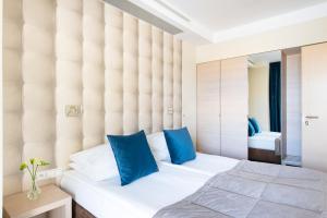 Łóżko lub łóżka w pokoju w obiekcie Hotel Arkon Park Business & Sport