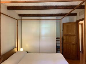 a bedroom with a bed and a wooden ceiling at Apartment Casa delle Palme by Interhome in Marina Romea