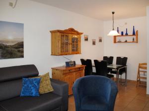 a living room with a couch and a table at Apartment Anke by Interhome in Damp