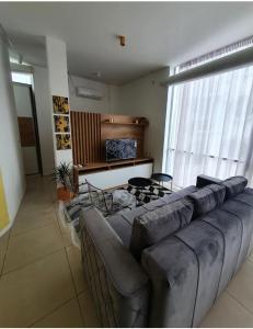 a living room with a couch and a table at Apartmani Queen in Kraljevo