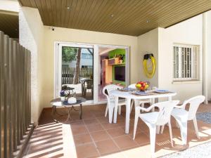 a patio with a table and chairs on a patio at Apartment Ancora by Interhome in Platja d'Aro
