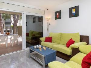 a living room with a couch and a table at Apartment Ancora by Interhome in Platja d'Aro