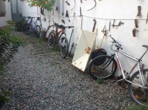 a group of bikes parked next to a wall at B&B Martina in San Vito