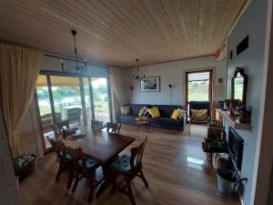 a living room with a table and a couch at Siedlisko Upałty in Giżycko