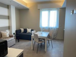 a living room with a table and a couch at Au Mà in Monterosso al Mare +21 photos