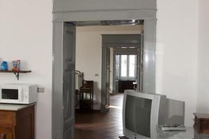 TV a/nebo společenská místnost v ubytování Palazzo D'Orsi