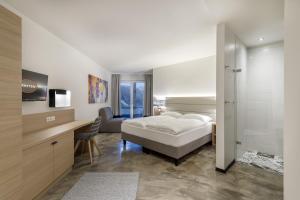 Posteľ alebo postele v izbe v ubytovaní Hotel Matteo