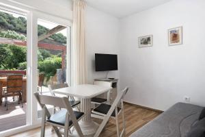 TV a/nebo společenská místnost v ubytování Casa de 10 - 5b