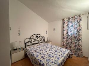 Кровать или кровати в номере Le Terme di Casteldoria