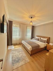 Un pat sau paturi într-o cameră la İmera Suite Otel