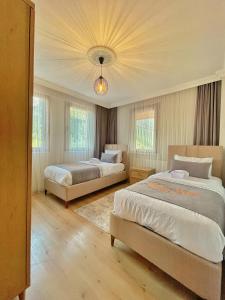 A bed or beds in a room at İmera Suite Otel