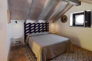 Кровать или кровати в номере Bella Baia Relais