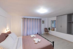 Posteľ alebo postele v izbe v ubytovaní Magdalenia's cozy apartments