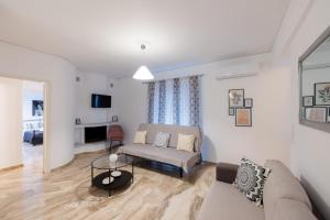 Televízia a/alebo spoločenská miestnosť v ubytovaní Magdalenia's cozy apartments