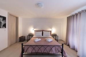 Posteľ alebo postele v izbe v ubytovaní Magdalenia's cozy apartments