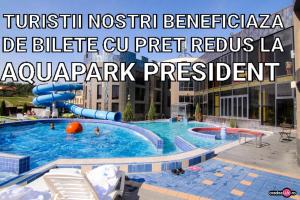 a large swimming pool in a building with people in it at Apartament Aqua Felix in Baile Felix