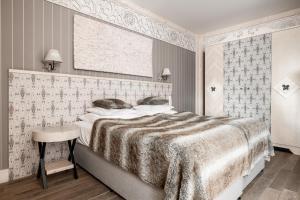 Posteľ alebo postele v izbe v ubytovaní Aries Hotel & SPA Zakopane