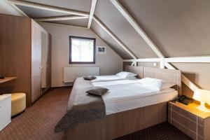 Postel nebo postele na pokoji v ubytování Complex Hotelier COTA O MIE