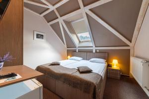 Postel nebo postele na pokoji v ubytování Complex Hotelier COTA O MIE