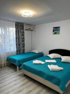 A bed or beds in a room at Vila Iris Mamaia Nord