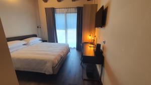 A bed or beds in a room at ORIZZONTI Vigneti Repetto