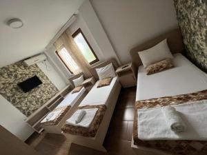 Postel nebo postele na pokoji v ubytování Hotel Ultra Star