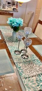 a table with three wine glasses on top of it at lovely 2BED 2BA vacation rental near the Beach in Pompano Beach