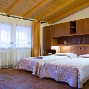 Säng eller sängar i ett rum på Agriturismo Da Merlo