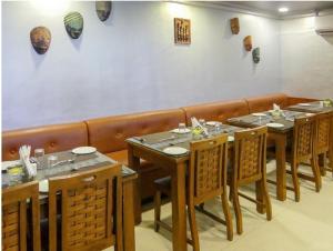Restoranas ar kita vieta pavalgyti apgyvendinimo įstaigoje Meenakshi's Sunshine Hotel