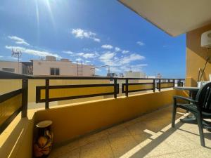 a balcony with a table and chairs on a roof at Edificio Sierra, 35 in Los Cristianos