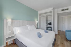 Postel nebo postele na pokoji v ubytování Barceló Ponent Beach