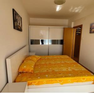 a small bedroom with a bed in a room at Apartman Nadja in Budva
