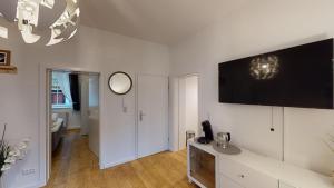 TV a/nebo společenská místnost v ubytování Lieblingsapartment No.2 in Top Citylage mit 1 SZ