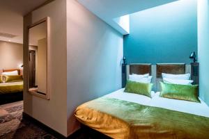 Cama o camas de una habitación en The Alfred Hotel