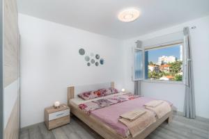 Postel nebo postele na pokoji v ubytování Blue Apartment G&G