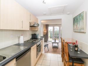 a kitchen with a counter top and a dining room at Thornhills Cottage in Bridgwater