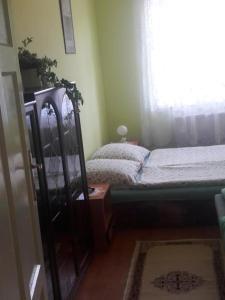 A bed or beds in a room at Chata Milan