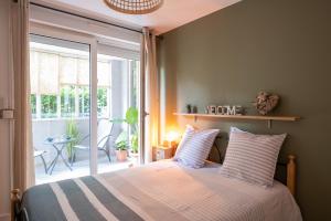 Posteľ alebo postele v izbe v ubytovaní Idéal couple Jacuzzi et jolie cour intérieure + 16 fotografií