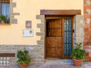 a wooden door on the side of a building at Apartment Angelita-1 by Interhome in Olocau del Rey