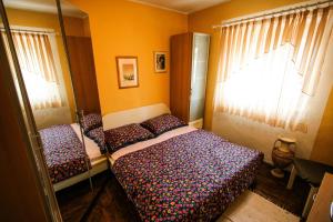 Posteľ alebo postele v izbe v ubytovaní apartman Iva