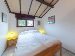 Postel nebo postele na pokoji v ubytování Holiday Home Duinenhuis 274 by Interhome