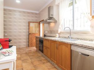 a kitchen with a sink and a dishwasher at Holiday Home Las Tijeras by Interhome in Rute +13 photos