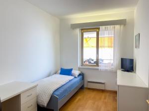 Postel nebo postele na pokoji v ubytování Apartment Lakeview by Interhome