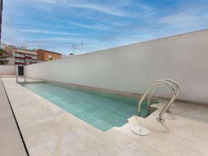 a swimming pool on the roof of a building at Apartment Cala by Interhome in Sant Antoni de Calonge