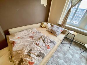 Posteľ alebo postele v izbe v ubytovaní Apartament w centrum Wrocławia w kamienicy