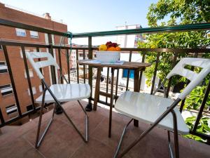 a table and chairs on a balcony with a bowl of fruit at Apartment Riumar by Interhome in Segur de Calafell