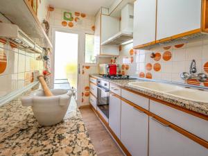 a kitchen with a sink and a counter at Apartment Riumar by Interhome in Segur de Calafell